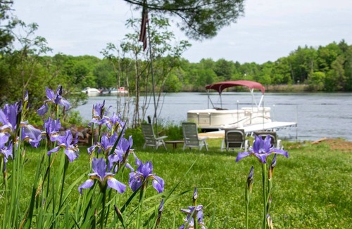 Holcombe House | Ultimate Family Lake Retreat w/Swim Slide, Sandy bottom, and Bar/TV Lounge