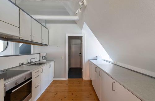 Copenhagen City Centre Apartment | Unique Apartment w Exposed Beams Next to Tivoli
