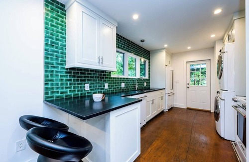 Benton Harbor Apartment | Unique container home retreat near Lake Michigan. Enjoy a peaceful, private setting with a spacious deck, firepit, and ravine views. Close to beaches, wineries, and downtown St. Joseph—perfect for a relaxing Southwest Michigan getaway.