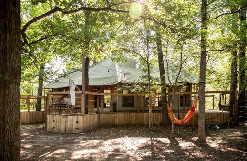 Dennis RV Rental | Unique Four-Person Luxury Tent with a Waterfall near Fort Worth, Texas
