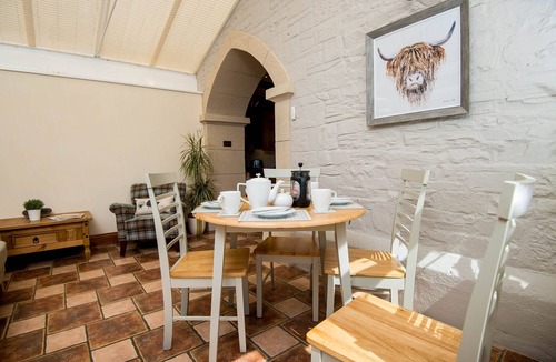 Llanddowror Cottage | Unique historic school‑house conversion with log burner