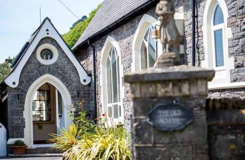 Llanddowror Cottage | Unique historic school‑house conversion with log burner