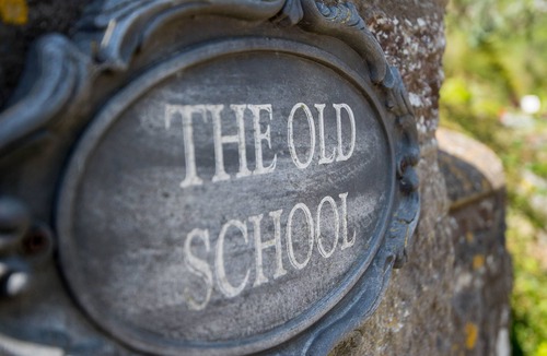 Llanddowror Cottage | Unique historic school‑house conversion with log burner
