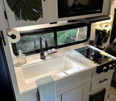Rosston House | Unique Jungle-Style Glamping RV with 8-Foot Suspended Tree Tent near Creek Trails in Forestburg, Texas