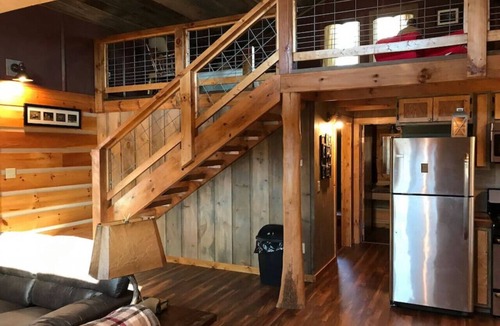 Elmdale Cabin | Unique Paw Print Cabin nestled in the Flint Hills!