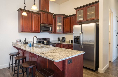 Moab Condo | Unique Stay in Downtown Moab! Master Bedroom Climbing Wall - Elevated Bunks