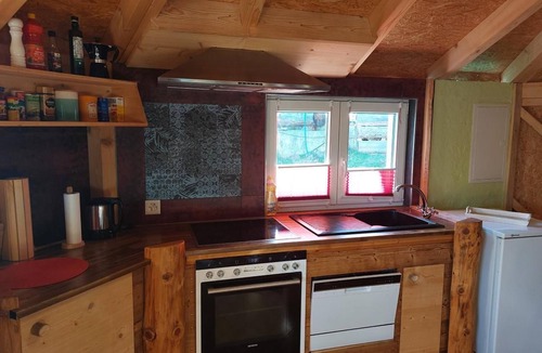 Sundlauenen Ski Chalet | Unique wooden hut with mountain panorama
