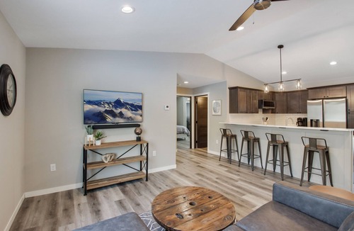 Cumberland Condo | Up North Living! Fully renovated one-level living home in wooded lot near lake.
