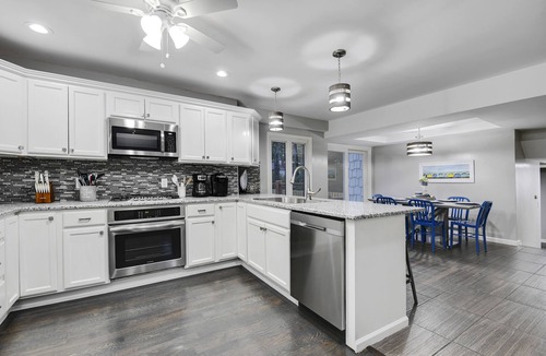 Overland Park House | Upscale 5BR Home w/Entertainer's Deck & Gated Driveway