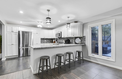 Overland Park House | Upscale 5BR Home w/Entertainer's Deck & Gated Driveway