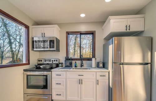 East Stroudsburg Cabin | Upscale Poconos Cabin w/ Pool and Lakes