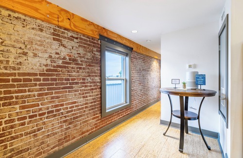 Rogers Apartment | Urban Brick Loft Studio Ride to Trails Walk to Dining, Shops & Nightlife