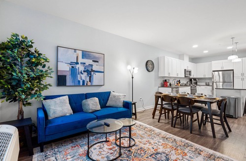 Hackensack River Waterfront Condo | Urban Elegance: 20 Minutes to NYC with Luxe Amenities- Gym and Laundry In Unit