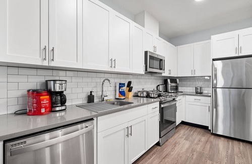 Hackensack River Waterfront Condo | Urban Elegance: 20 Minutes to NYC with Luxe Amenities- Gym and Laundry In Unit