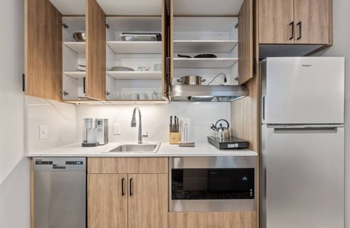 Main - Military Plaza Hotel | Urban Elegance—Steps from River Walk | In-Unit Laundry & Kitchen
