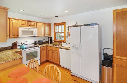 Chincoteague House | Utter East | 4BR Island Retreat, Huge Screened Porch, Decks + Fire Pit by Pond