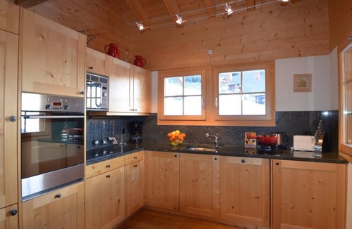 Grimentz Ski Chalet | Very comfortable chalet for 8 persons : Living room with non usable fireplace - kitchen with dishwas
