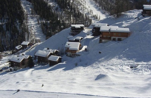 Grimentz Ski Chalet | Very comfortable chalet for 8 persons : Living room with non usable fireplace - kitchen with dishwas
