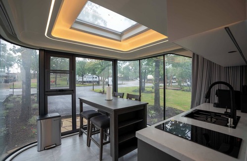 Runaway Bay Apartment | Vessel 10 - Elevated Vessel Experience | Waterfront Backyard Fast Internet