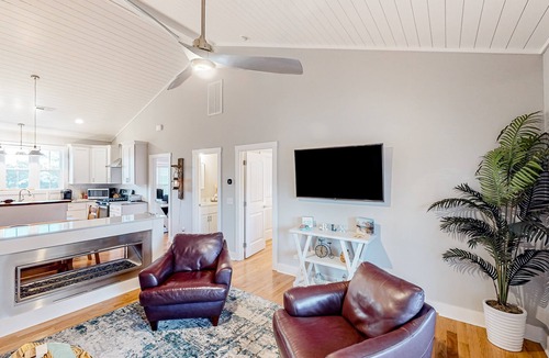 Tranquil Harbour House | Vibrant beach-themed stay with balconies, enclosed yard, extra kitchenette, & AC