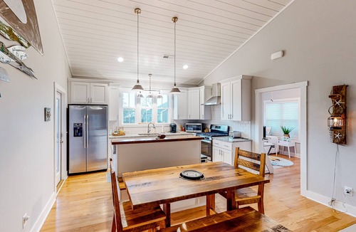 Tranquil Harbour House | Vibrant beach-themed stay with balconies, enclosed yard, extra kitchenette, & AC