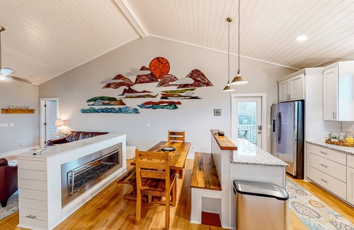 Tranquil Harbour House | Vibrant beach-themed stay with balconies, enclosed yard, extra kitchenette, & AC