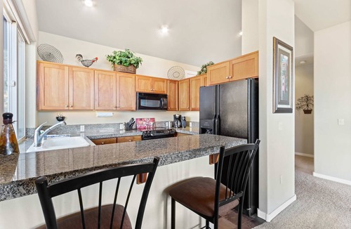 Redmond Condo | Vibrant home with fireplace, large balcony & access to indoor-outdoor pools