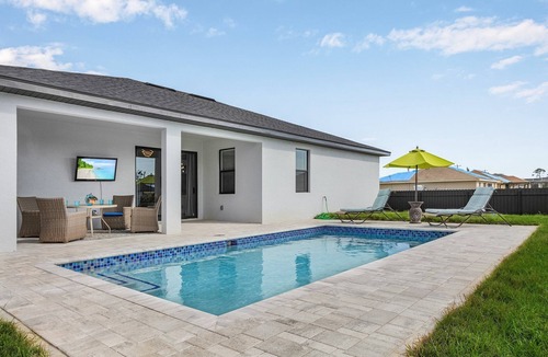 Del Tura Villa | Villa Del Sol Vacation HEATED Pool home with outdoor TV and work, office room.