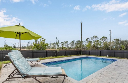Del Tura Villa | Villa Del Sol Vacation HEATED Pool home with outdoor TV and work, office room.