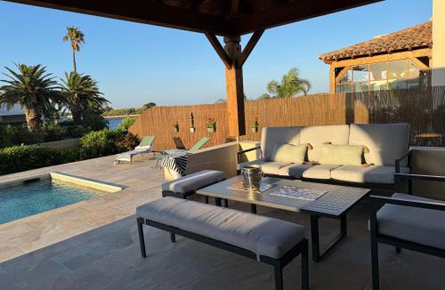 Saint-Cyprien Plage Villa | Villa Moana Lagune 4 chambres, 4 salles de bain, piscine privative chauffée à 30 degrés toute l année, balnéo, terrain de pétanque privé, ping-pong