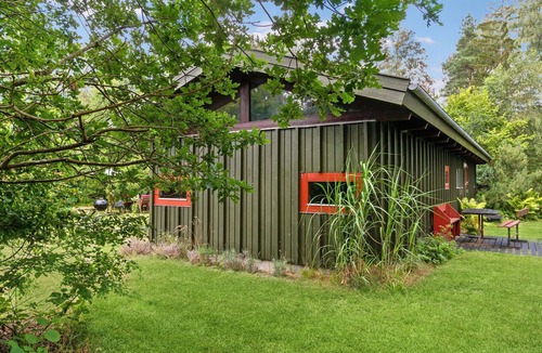 Rrvig House | Visit this charming wooden house surrounded by wonderful nature.