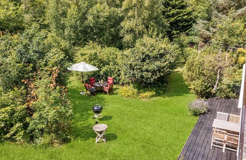 Rrvig House | Visit this charming wooden house surrounded by wonderful nature.