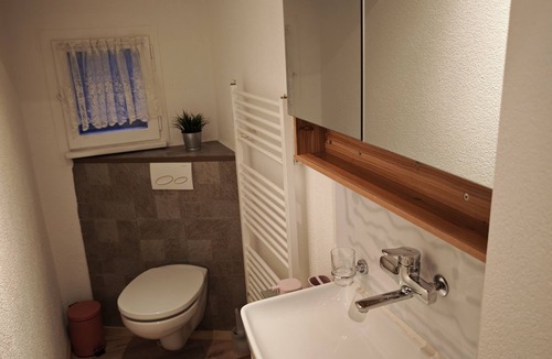 Lungern Condo | “Wake Up to Lake & Mountain Views with a Magical Summer Waterfall”