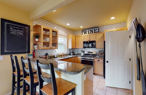 Olga House | Walkable Bay-view home with large yard, firepit & washer/dryer - pier access