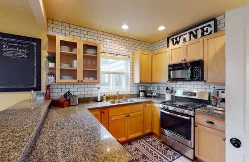 Olga House | Walkable Bay-view home with large yard, firepit & washer/dryer - pier access