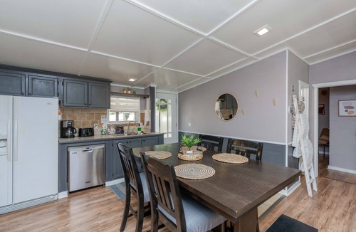 Enchanted Oaks House | Water Front Lake Cabin Pet Friendly and FREE Paddle Boat and Kayaks!