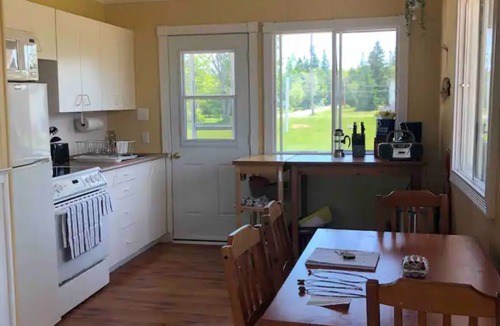 Petite-Riviere-de-l'Ile Cottage | Water view cottage with hot tub, beach access and fire pit