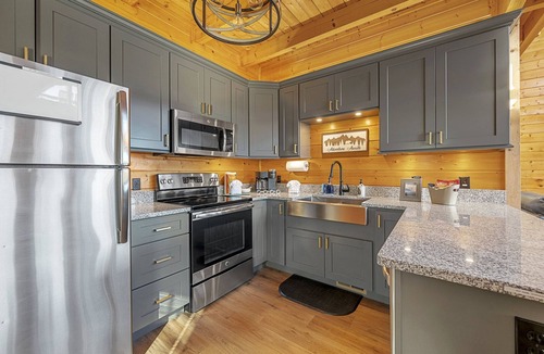 Sevierville Cabin | Waterfall, Hot Tub, Fire Pit + 20 Mile View