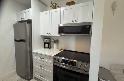 Madeira Beach Condo | Waterfront 1st Floor, 2 Pools. Walk to restaurants. Boat Slip No Extra Fees