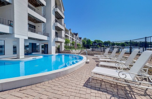Charlevoix Condo | Waterfront Access| Pool, Hot Tub, Sauna | Sleeps 4
