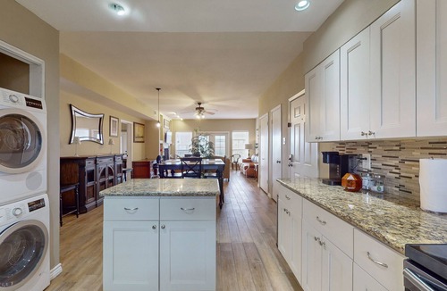 El Lago Condo | Waterfront community condo with on-site pool, water views, & private patio