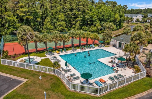 Sunset Beach Condo | Waterfront condo with pool, tennis, bikes & lagoon/golf views - near the beach