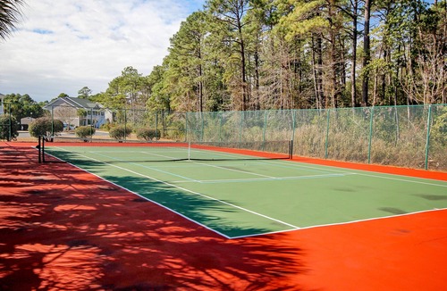 Sunset Beach Condo | Waterfront condo with pool, tennis, bikes & lagoon/golf views - near the beach