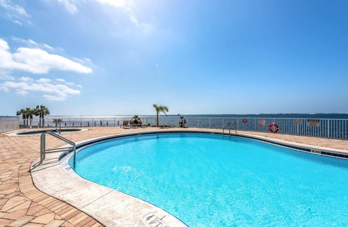 Ono Island Condo | Waterfront condo with beach access, pools, balcony, central AC, & W&D