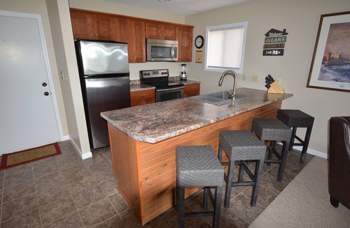 Lake Ozark Condo | Waterfront Condo with Walk-Out to Pool & Lake! Beautiful Inside! Electric Grill!