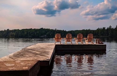 Whitestone Cottage | Waterfront Cottage on Shawanaga Lake | Sunset | Starlink | Sand Beach + Dock