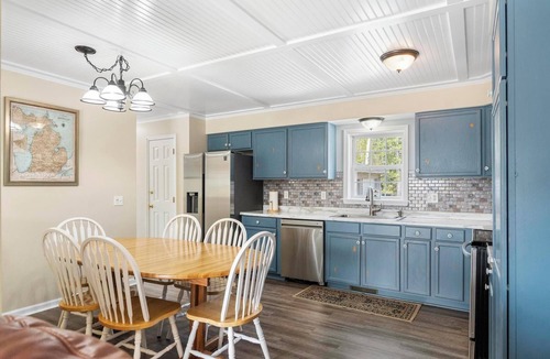 Alanson House | Waterfront Cottage with Covered Boat Slip