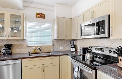 Key Colony Beach House | Waterfront Half-Duplex with 30-Ft. Dock, Sitting Pool, and Private Beach Access