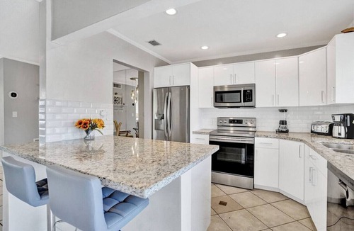 North Corals House | Waterfront Heated Pool, Jacuzzi, Private Pier, 2mi to Beach