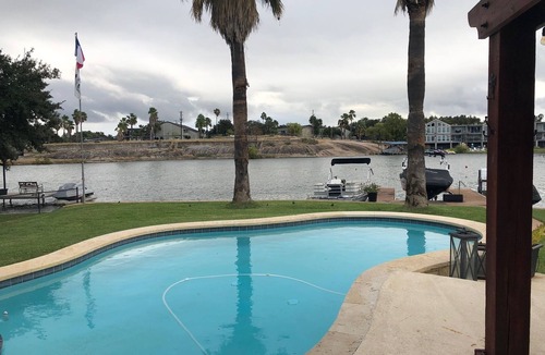 Granite Shoals House | Waterfront Home with pool Surrounded by Palm Trees